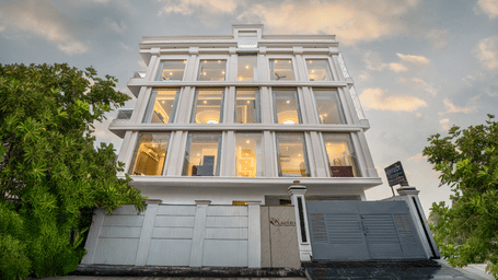 The exterior view of Perfectstayz Premium Kaashin, Varanasi, showing the building façade and entrance area.