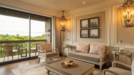 Full view of the living room of the Evren Suite with a balcony beside it at The Evren, Vagator.