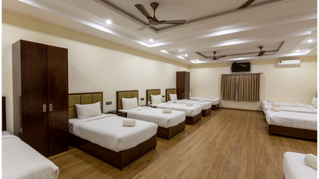 Comfortable 900 sq. ft. Group Room in Chikkamagaluru designed for up to 11 guests with modern comforts.
