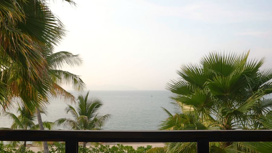 A scenic view of the beach through the balcony in one of our rooms - Alibu Resort Nha Trang