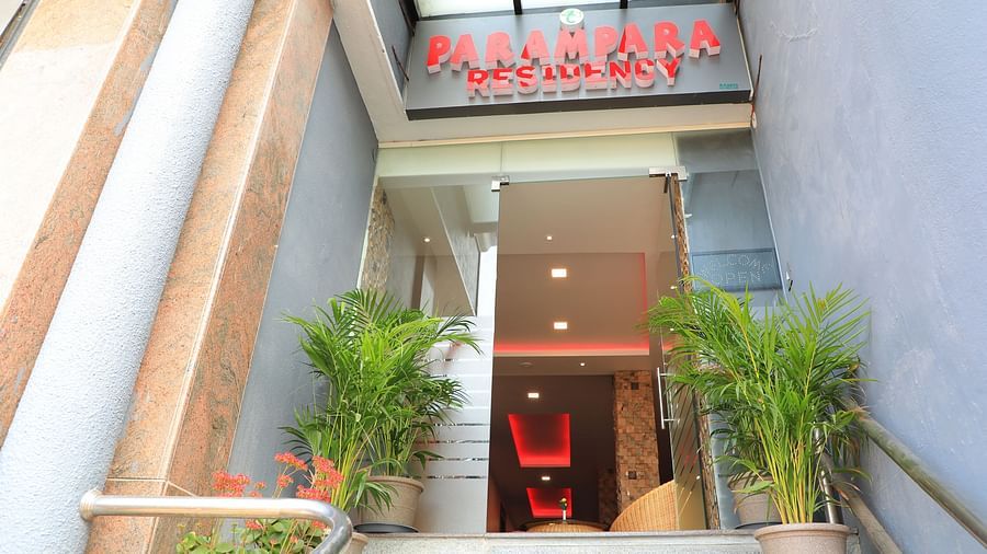 Facade of Parampara Residency, Kushalnagar Town with Parampara Residency written above the entrance.