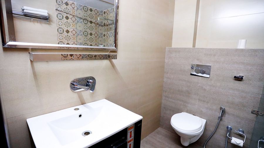Image of a washroom with a sink and a toilet at Amara Hill Queen, Mussoorie.