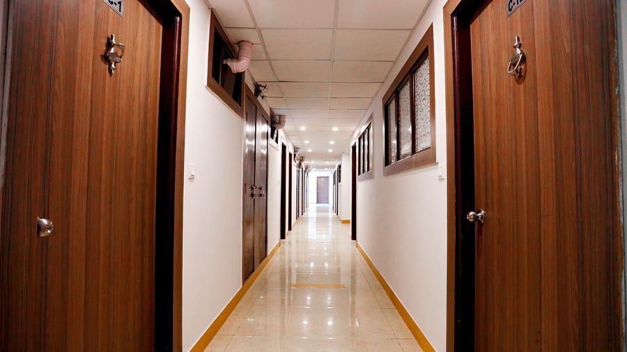 Image of a hallway with doors on the side at Amara Hill Queen, Mussoorie.
