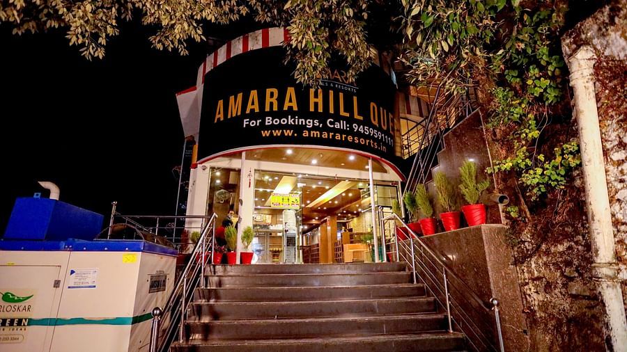 Image of a staircase with a signboard above that reads Amara - Amara Hill Queen, Mussoorie.