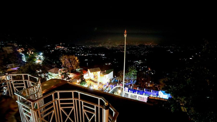 A captivating night view of Mussoorie city, illuminated by the glow of twinkling city lights.