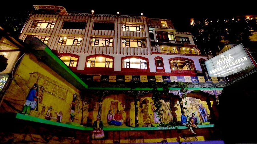Facade of Amara Hill Queen, Mussoorie illuminated with light.