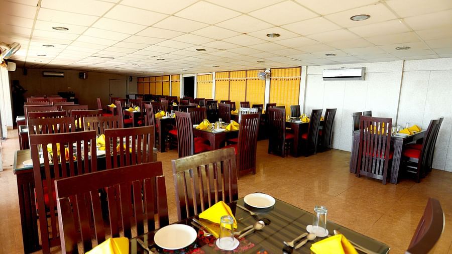 Image of a table with napkins arranged on the table at Amara Hill Queen, Mussoorie.