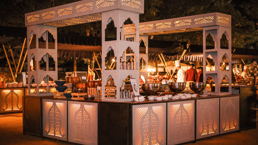 A service pavilion with food counters, serving areas and staff at Ananta Spa and Resort, Jaipur