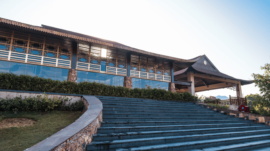 An exterior stair entry leading to a large building with landscaping at Ananta Spa and Resort, Jaipur