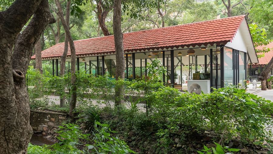 exteriror image of the in house dining restaurant at aranya vilas featuring transparent glass partitions