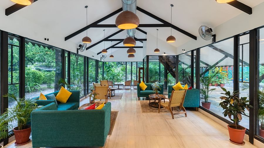 image of the lobby with chic modern interiors and ample of seating area for the guests at aranya vilas