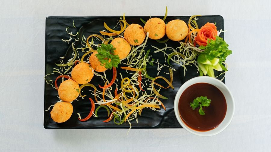 image of a pani puri platter served with shredded greens at aranya vilas 