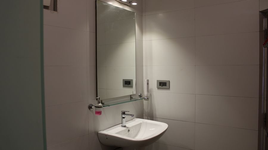 Image of the handwash area with wall mirror at Arcadia Heritage Resort, Darjeeling