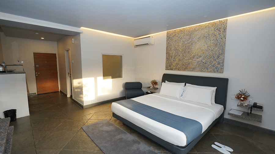 An image of a bedroom with twin beds and other room amenities - Argo By Trance, Goa
