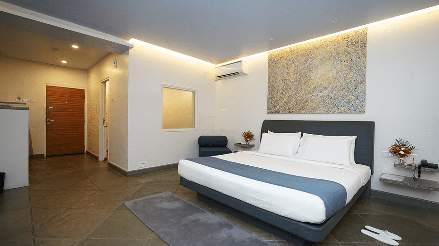 An image of a bedroom with twin beds and other room amenities - Argo By Trance, Goa