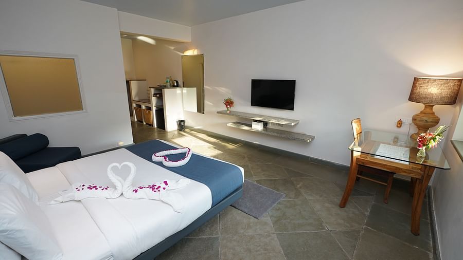 An image of a bedroom with twin beds and other room amenities - Argo By Trance, Goa