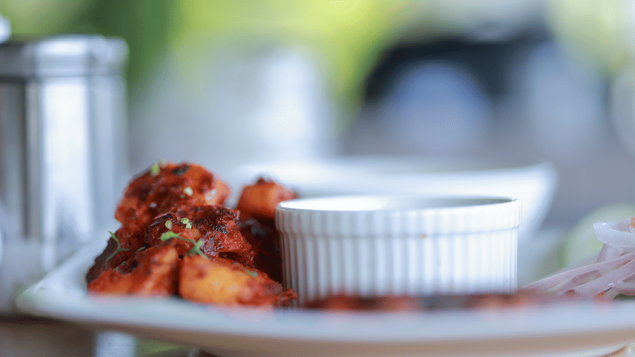 Close up of a dish taken from the side, kept on a table at Aveda Mountains and Mist Resort and Spa, Munnar.