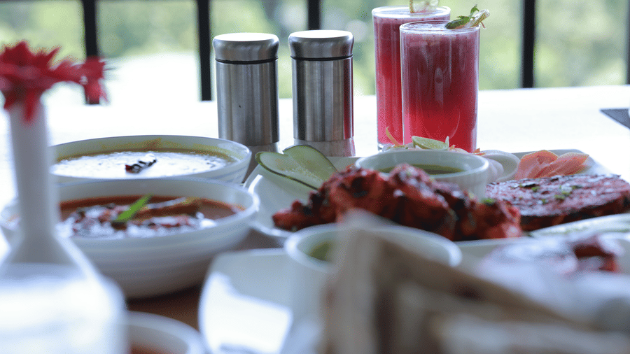 Close up several Indian delicacies served at the Machaan restaurant along with refreshing beverages at Aveda Mountains and Mist Resort and Spa, Munnar.