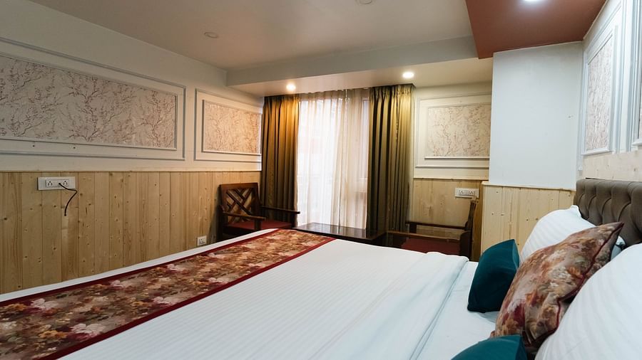 An image of close up shot of a bedroom with multiple pillows at Avianna New Mandala Hotel & Spa, Darjeeling.