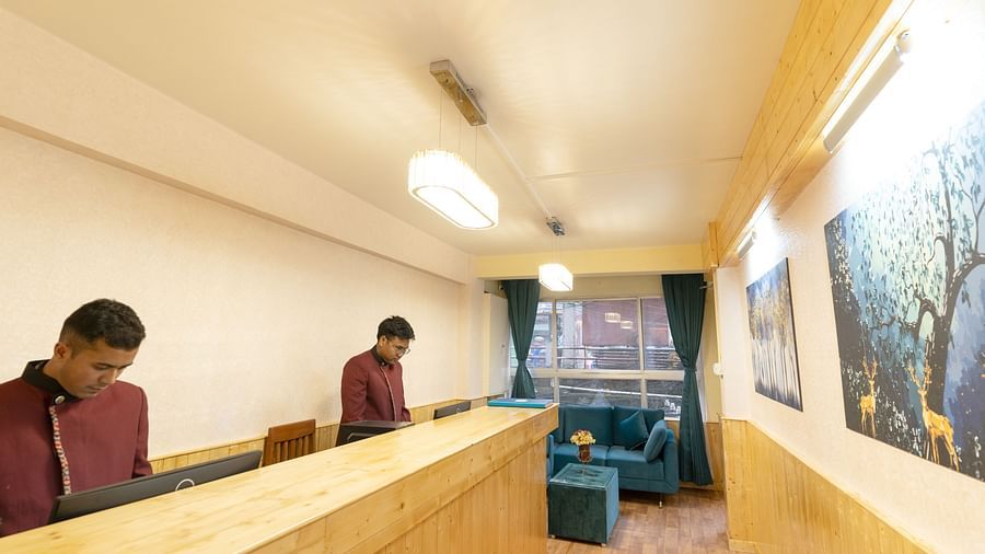 Reception with wooden desk and long hall way at Avianna Seven Seas, Darjeeling