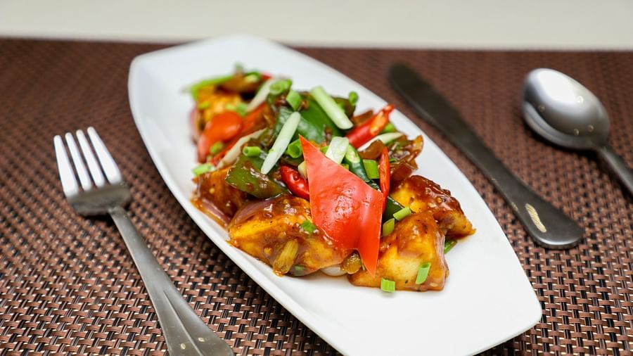 a close up shot of a meal served with cutlery