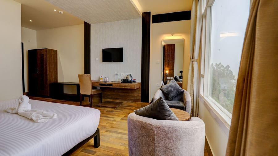 view of king size bed and TV of a Deluxe Room Banari Regency by Summit, Namchi