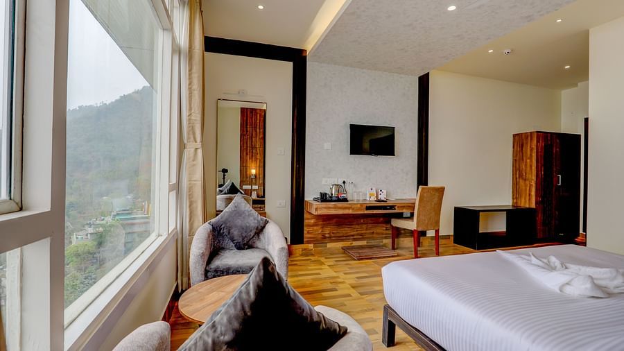 view of king size bed and TV of a Deluxe Room Banari Regency by Summit, Namchi