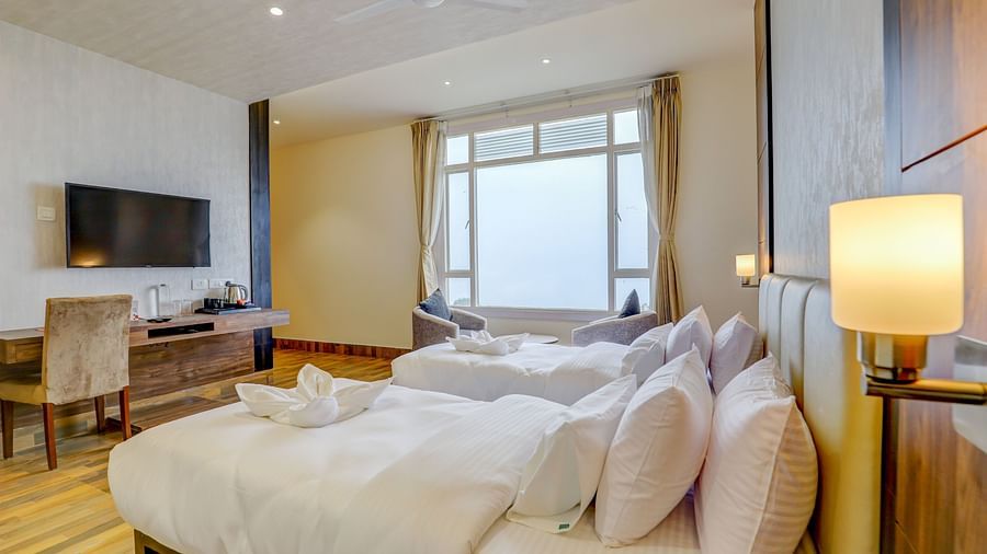 view of twin beds and TV of a Premium Room at Banari Regency by Summit, Namchi