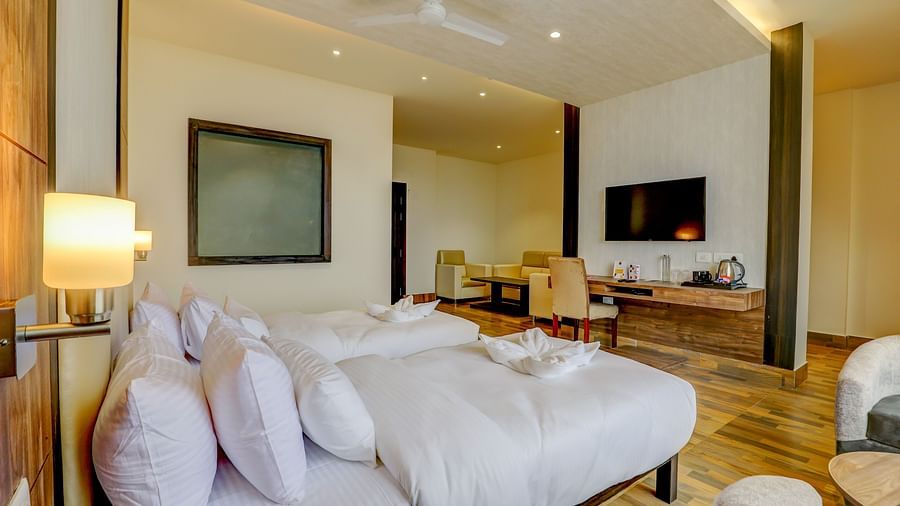 view of twin beds and TV of a Premium Room at Banari Regency by Summit, Namchi