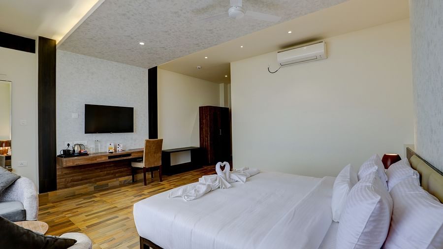 view of a king size bed of a Suite at Banari Regency by Summit, Namchi