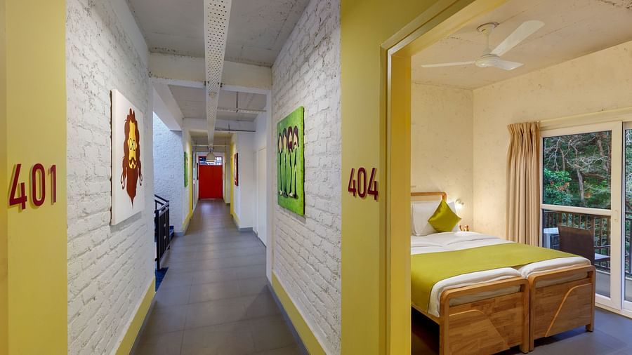 Interior corridor with doors leading to rooms on both sides at Bedzzz, Rishikesh