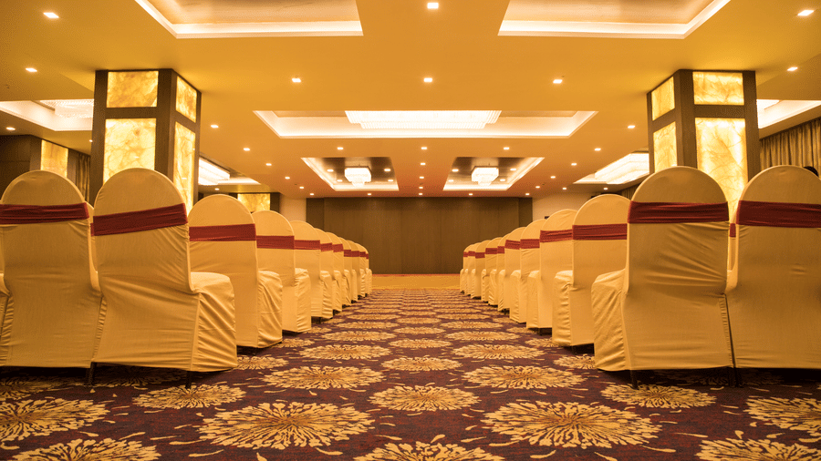 A conference or event room at Benzz Park Chennai with rows of chairs facing a central aisle.