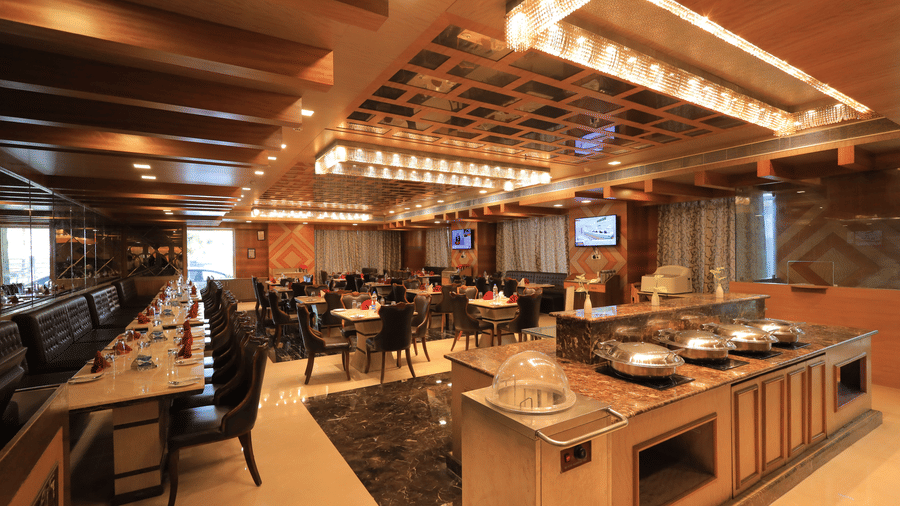 Corner-view shot of the Porchae restaurant featuring a buffet counter overlooking the elegant dining area.