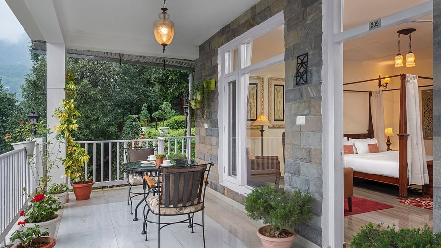 Charming balcony space with seating and scenic greenery, adjoining a bedroom suite, at BluSalzz Collection - Suvaasa Resort, Ramgarh.