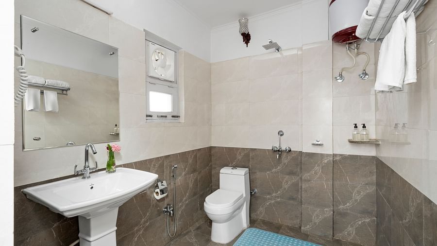 Modern bathroom with sleek fittings and tiled interiors at BluSalzz Collection - Suvaasa Resort, Ramgarh.