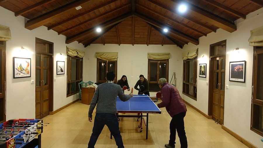 Guests enjoying a game of table tennis in the recreational room - BluSalzz Escapade - Anant Rasa Resort