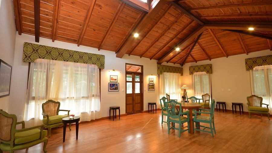A spacious conference room in Almora with elegant wooden interiors and comfortable seating - BluSalzz Escapade - Anant Rasa Resort