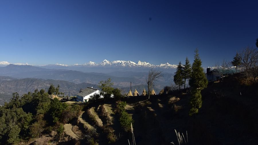 A panoramic hillside view with distant snowy peaks - BluSalzz Escapade - Anant Rasa Resort