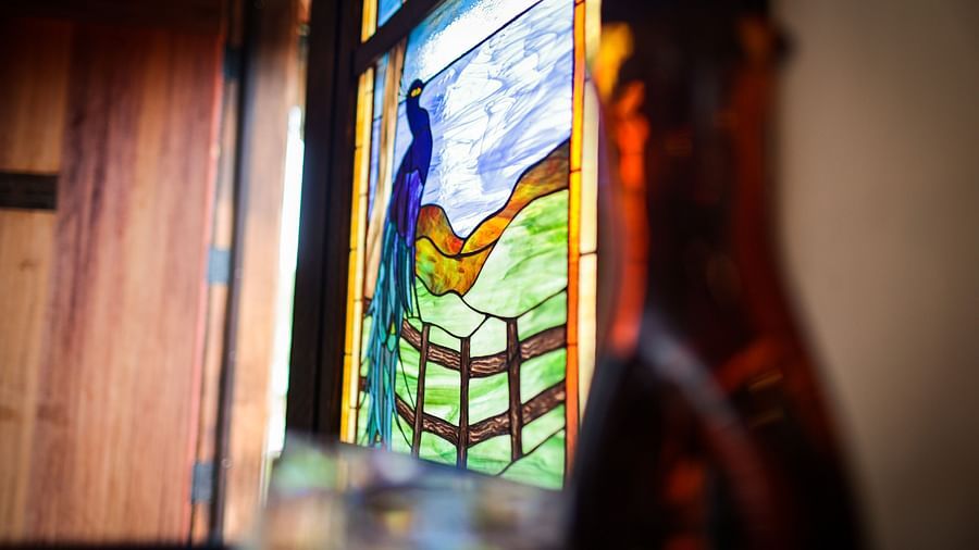 Close-up of a stained-glass window with colorful patterns reflecting light - Brewery Gulch Inn & Spa