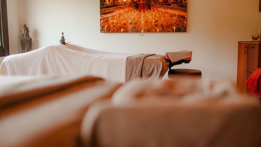 A plush massage bed with soft linens for the ultimate relaxation at The Pavilion, Brewery Gulch Inn & Spa