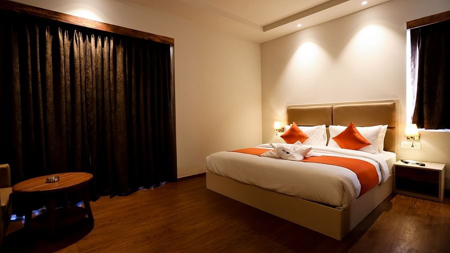 Image of a room with a bed and a window beside it at Calux Grand Baga.