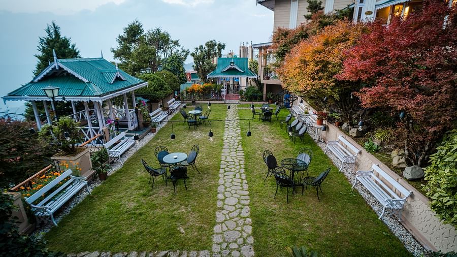 Outdoor seating area with lawn and gazebo at Cedar Inn