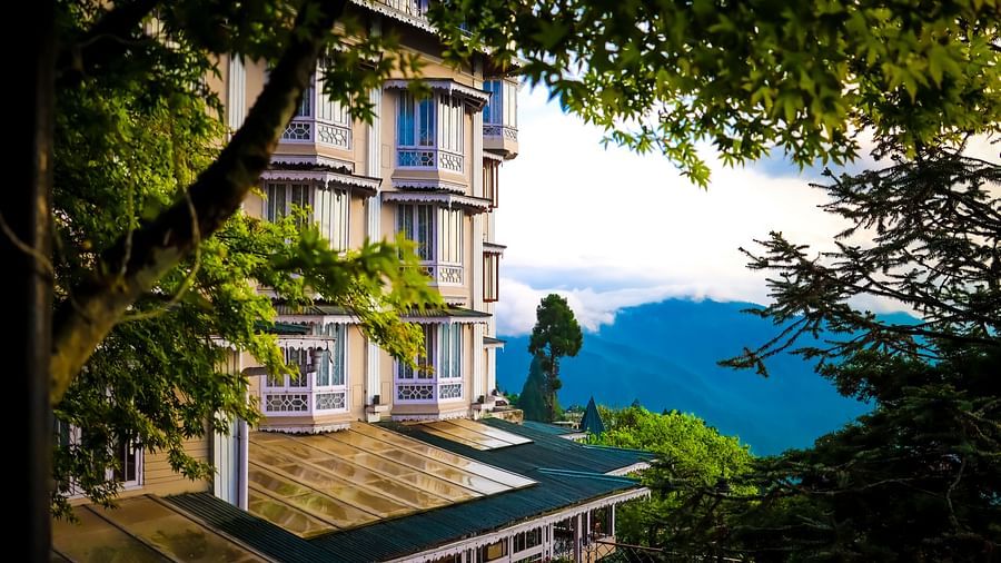 Scenic side view of Cedar Inn surrounded by greenery