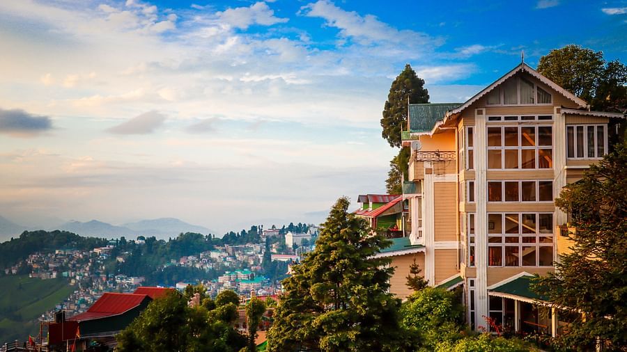 Cedar Inn with hillside views and blue sky