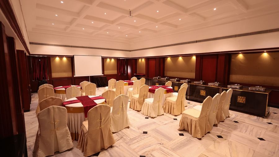 A banquet hall view from behind, with decorated tables and chairs | Cenneys Gateway