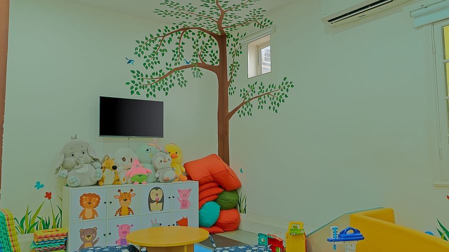 A brightly decorated playroom with a TV and play area | Central Mansions, Phnom Penh