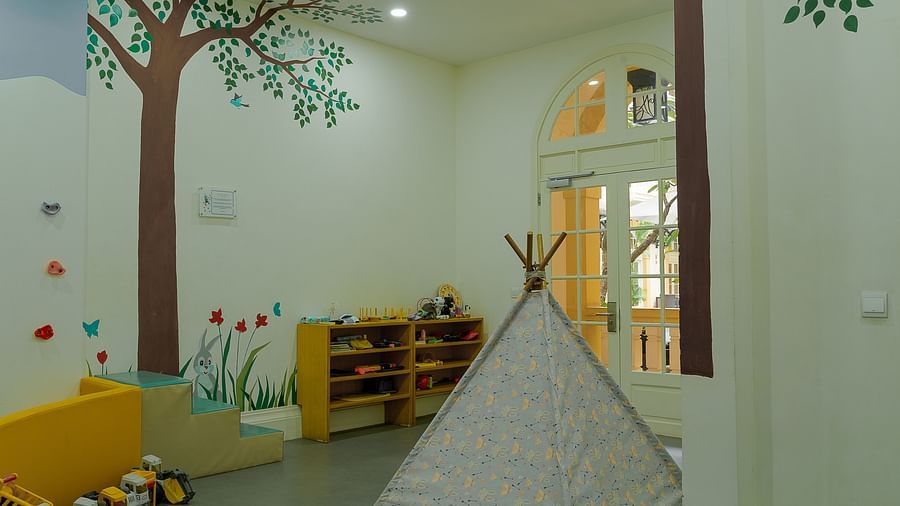 A brightly decorated playroom with a camping tent and play area | Central Mansions, Phnom Penh