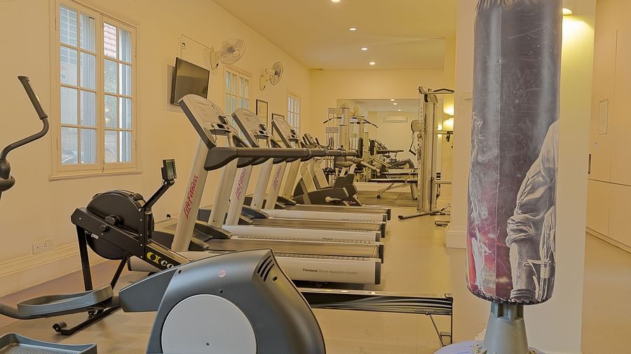 A gym with various exercise machines and equipment | Central Mansions, Phnom Penh