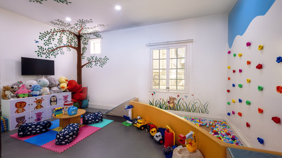Children’s play area with toys, colourful activities, and seating at Central Mansions, Phnom Penh.
