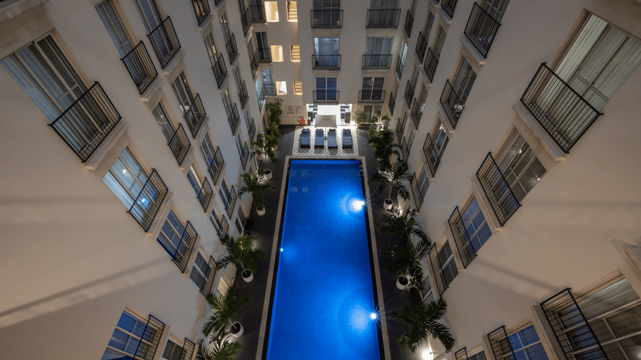 Aerial view of the swimming pool surrounded by the buildings at Central Mansions, Phnom Penh.